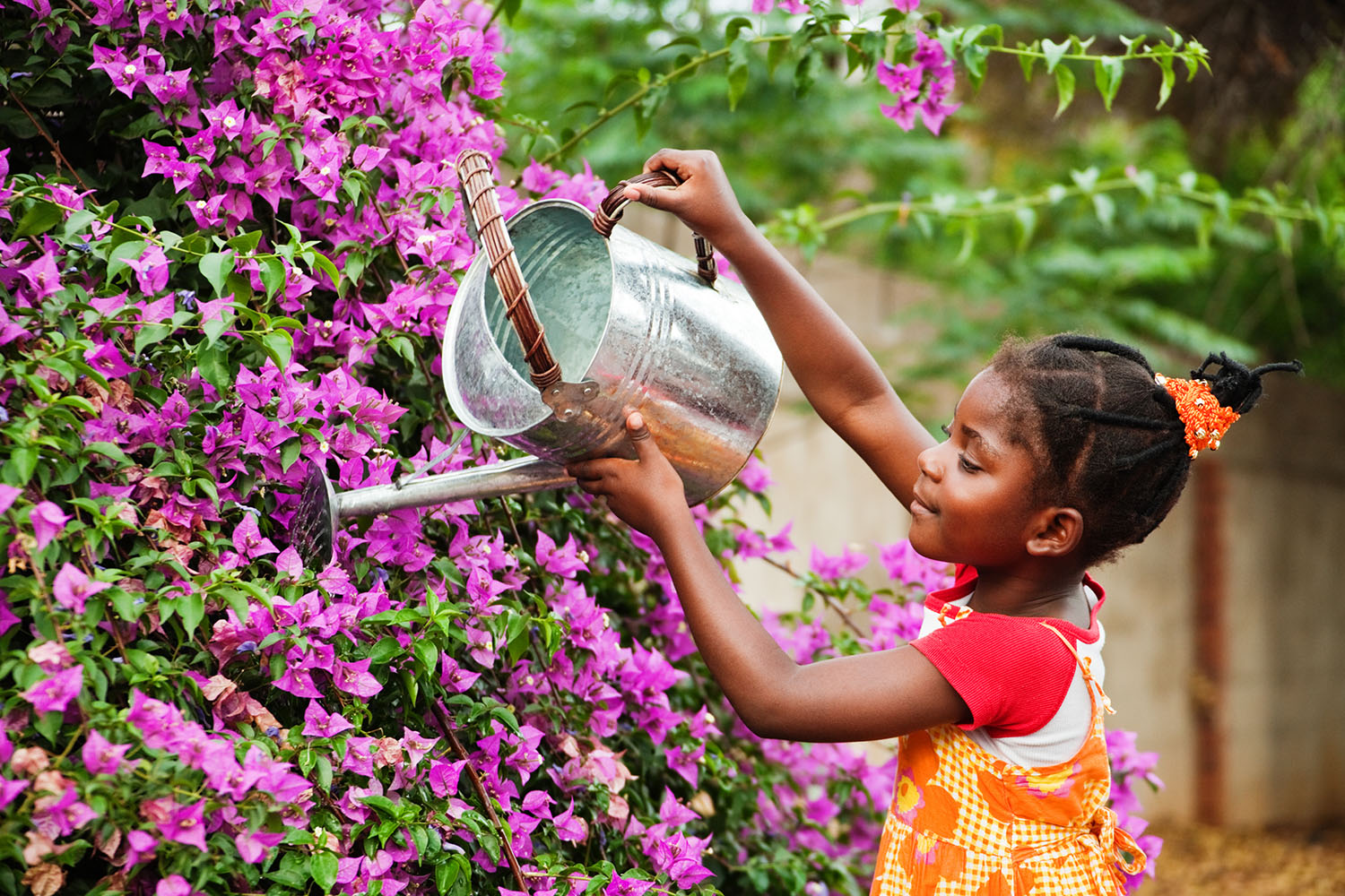 Girl watering flowers